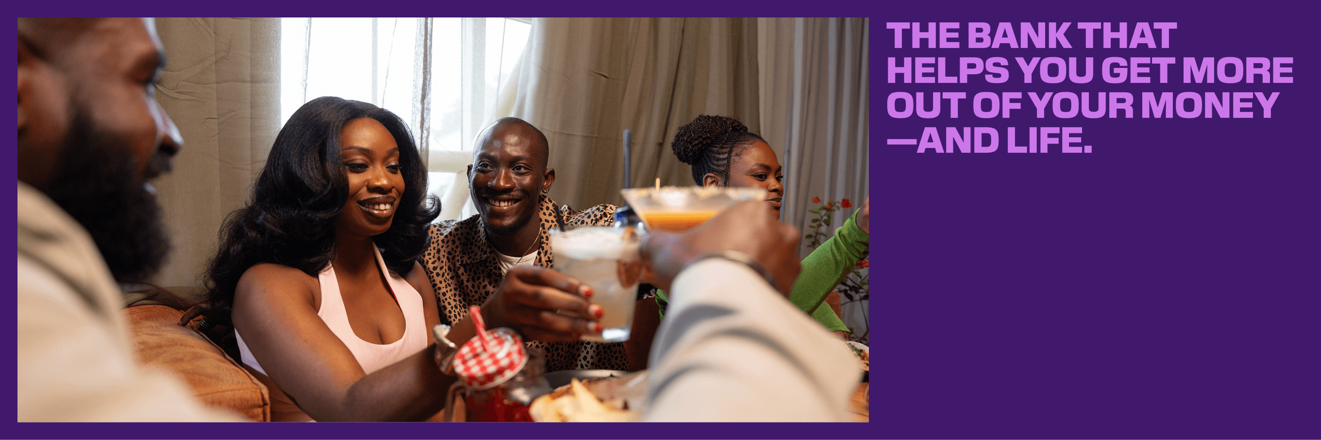 A campaign image: friends toasting over a table of food, beside the line “The bank that helps you get more out of your money — and life.”